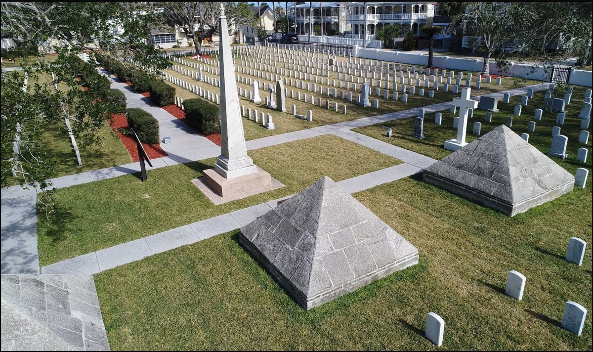 Aerial drone view of the coquina pyramids and Dade Monument obelisk at St. Augustine National Cemetery